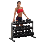 Female athlete stands behind Body-Solid 3 Tier Horizontal Dumbbell Rack GDR363