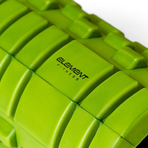 CLose up of lime green Element Fitness Foam Roller 13"