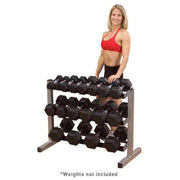 Female athlete stands behind Body-Solid 3 Tier Horizontal Dumbbell Rack GDR363