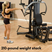 Female athlete uses Body-Solid Fusion 500 Home Gym with 210-Pound Weight Stack F500-2 for shoulder raise. 210 pound weight stack available. 