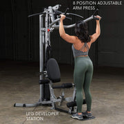 Female athlete does lat pulldown on Powerline by Body-Solid BSG10X Home Gym