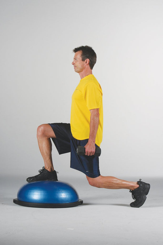 MAle athlete uses BOSU® Balance Trainer for lunge. 