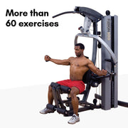 Male athlete uses Body-Solid Fusion 500 Home Gym with 210-Pound Weight Stack F500-2. More than 60 exercises available. 