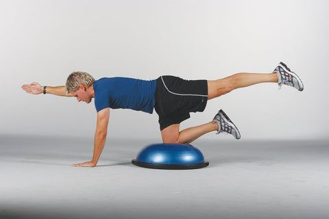 Male athlete uses BOSU® Balance Trainer