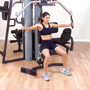 female athlete uses Body-Solid G9S Two-Stack Gym for chest fly 