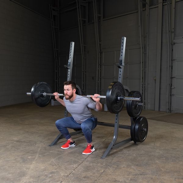 Male athlete does squat using POWERLINE MULTI-PRESS RACK