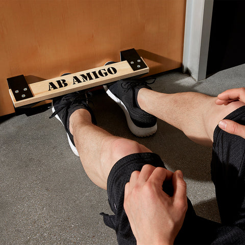 Male legs using Ab Amigo Doorway Sit-Up Assist