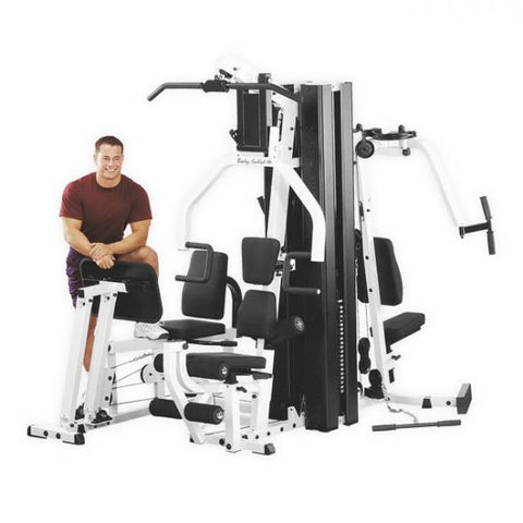 Male athlete uses Body-Solid EXM3000LPS Gym System